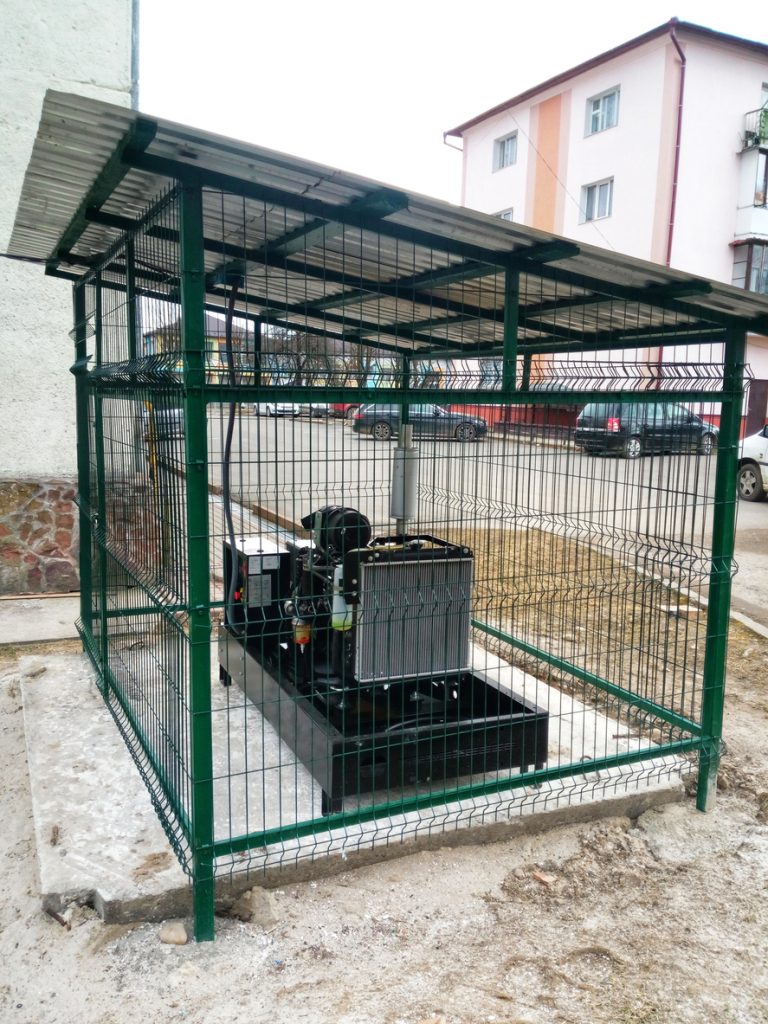Outdoor backup generator in a metal enclosure